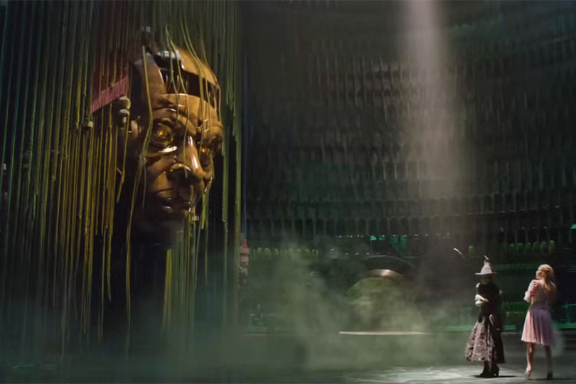 20 Fun Facts About The New 'Wicked' Movie - The wizard's large wooden head